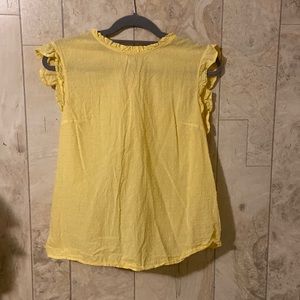 Yellow H&M shirt.
